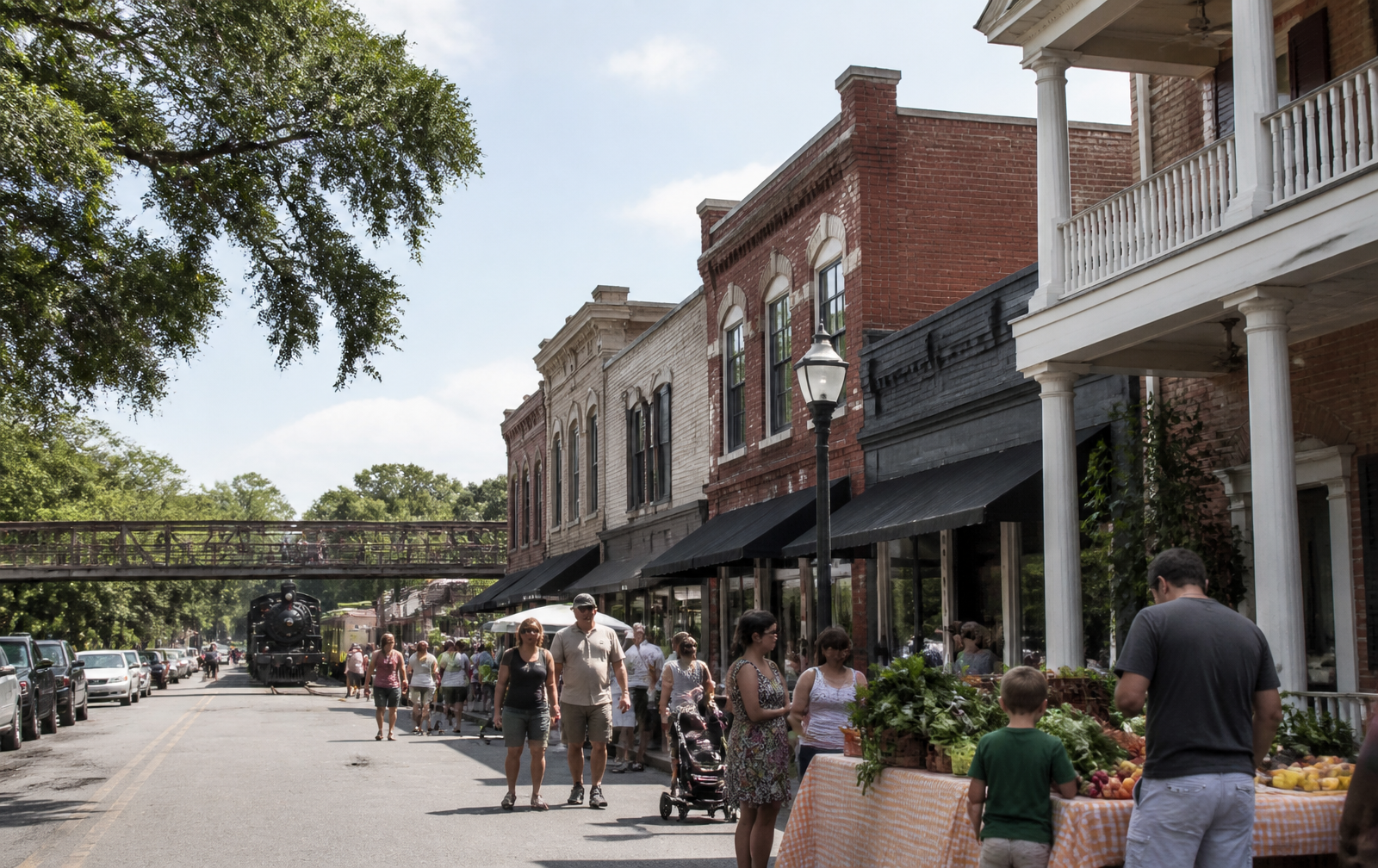 Main Street storefronts, the farmers market and the railroad footbridge in downtown Waxhaw, North Carolina